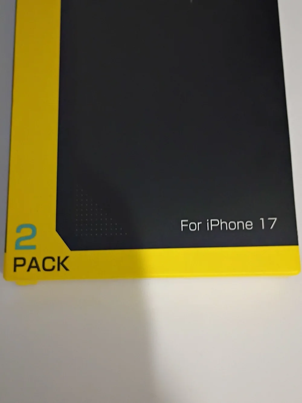 Never Breaki Screen Protector for iPhone 17 - Black & Yellow Packaging